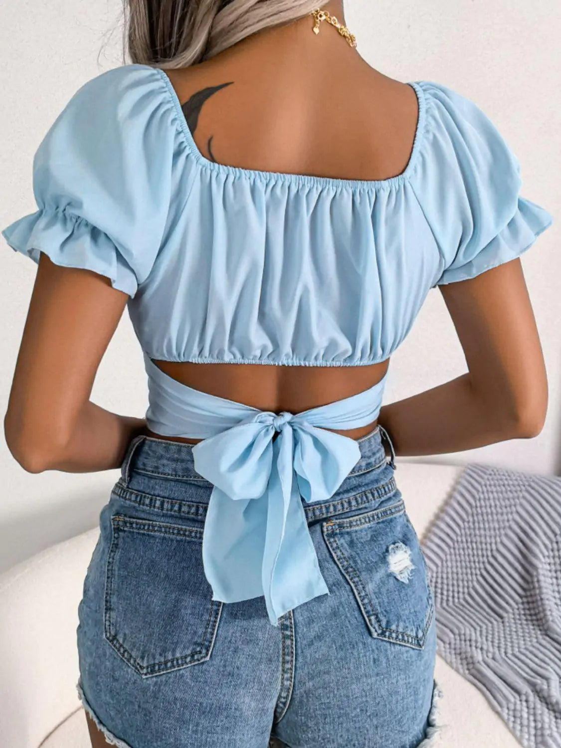 Crop top with crossed ruffle sleeves and square neck